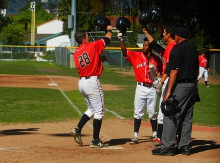 Andrew Schatz, left, celebrates with Joseph Hamilton and Wes Ghan-Gibson after an earlier homer at Pershing Park. He hit his third homer in Saturday's 7-5 setback at Moorpark. (Photo by Dave Loveton)