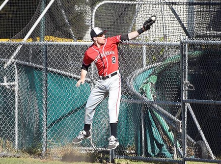 Sophomore right fielder Reinhard Lautz makes a leaping catch of a foul ball during Saturday's 13-2 win. Lautz went 4-4 and scored four times. (Photo by Ken Sciallo / Sevilla Photography)