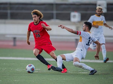 Yair Meluka, a freshman forward from Israel, eludes a defender in the first half of Tuesday's season opener. (Photo by PJ Heller/Sevilla Photography)