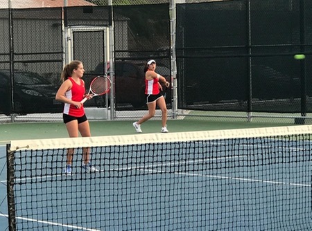 Brenna Casey, left, and Lesly Zapata De Lira won their No. 1 doubles match 8-4 to forge a 4-4 tie in the season opener.